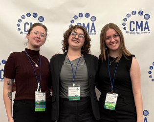 Three students at CMA Spring Convention step and repeat