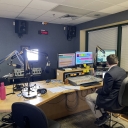 WASU FM news anchor providing election coverage.
