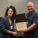 Dr. Kananovich accepts her award certificate.